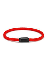 red rope bracelet on white background