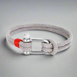 Grey rope bracelet styled with a red accent and silver clasp, handcrafted for elegance