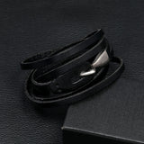 black bracelet on black surface